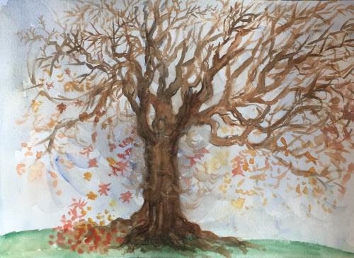 The tree stands in the autumn wind